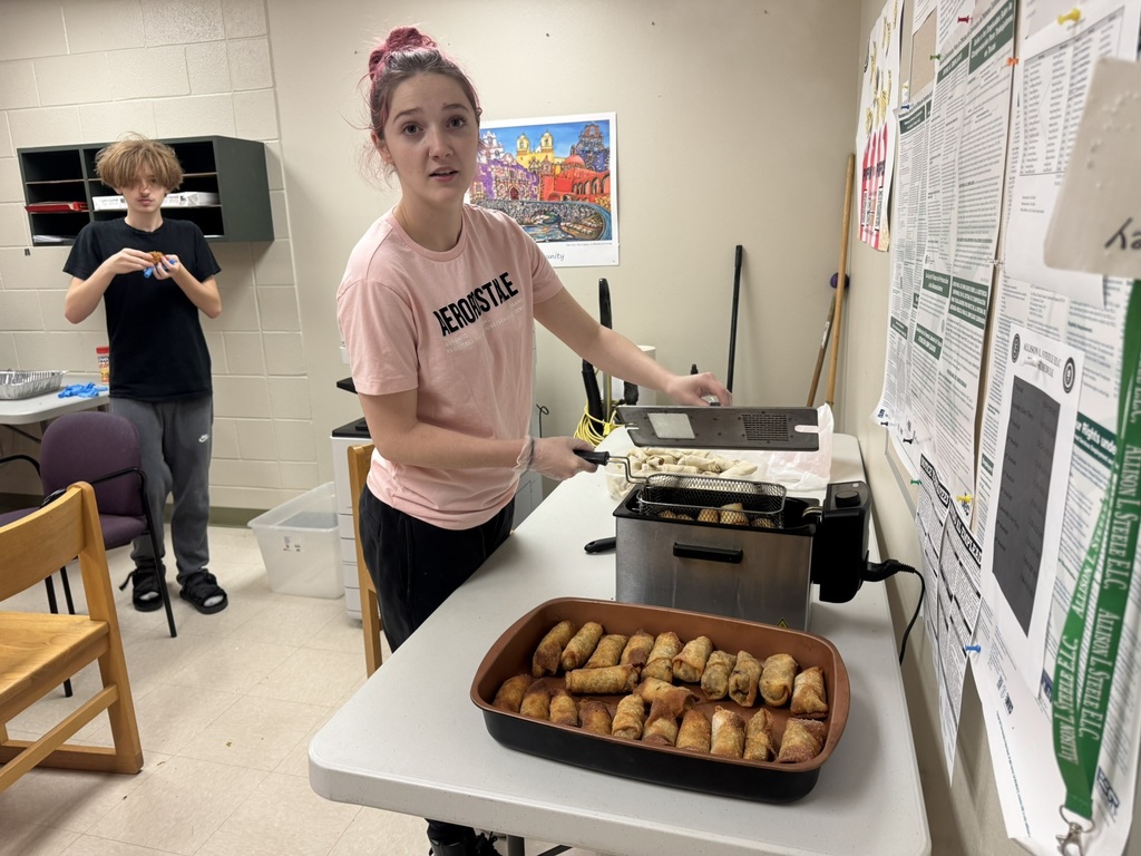 female student frying chicken