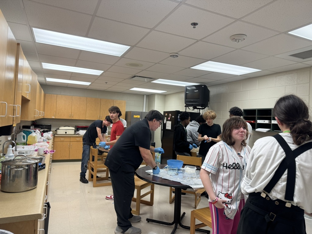 students and principal cooking