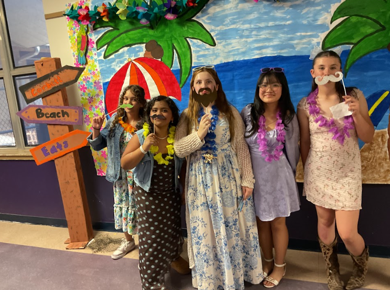 Five girls wearing fake mustaches for a picture