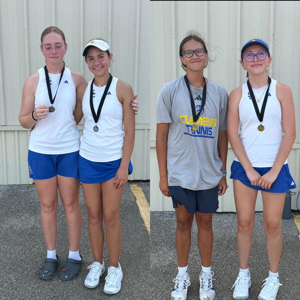 high school tennis players admire & show off their medals