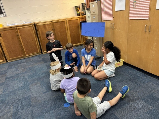 PreK students helping 4th graders with their service project.