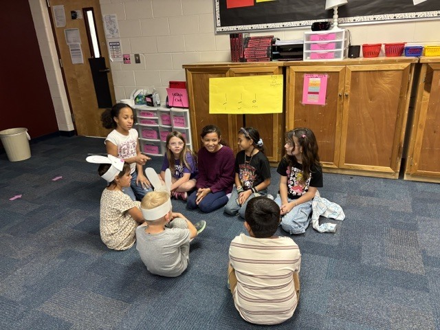 PreK students helping 4th graders with their service project.