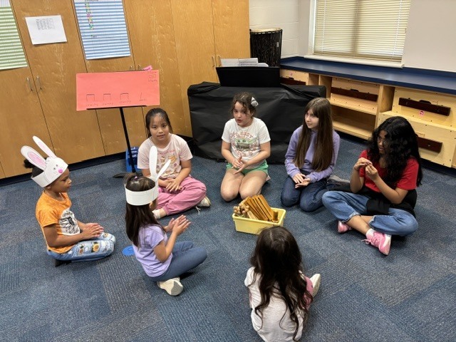 PreK students helping 4th graders with their service project.