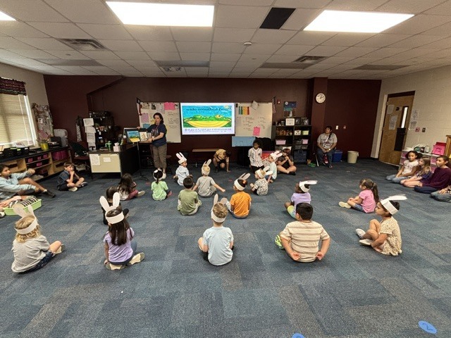 PreK students helping 4th graders with their service project.