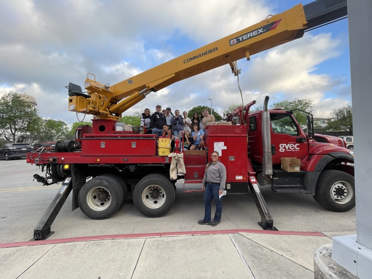 classroom imposing with a big utility drill truck