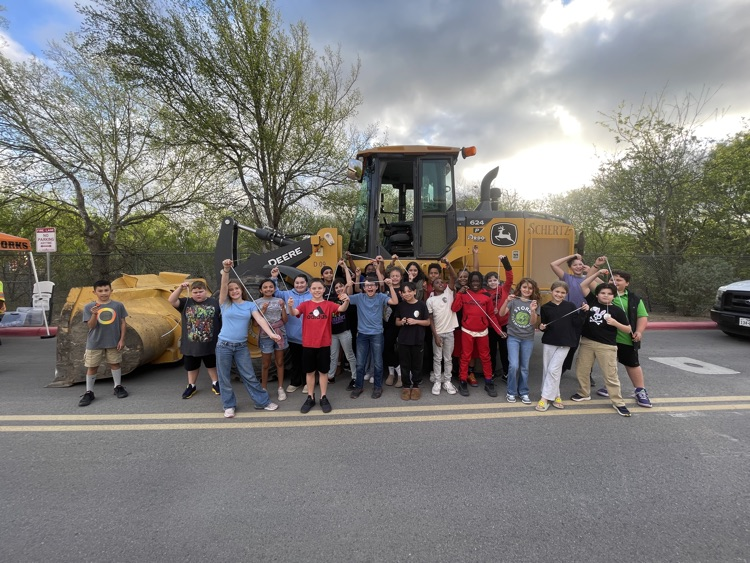 Students in front of utility truck construction truck vehicle