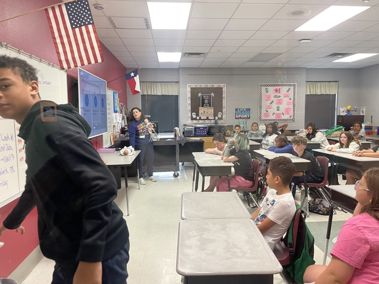 student listening to presentation in the classroom