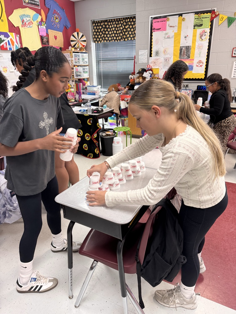 two girls cup stacking