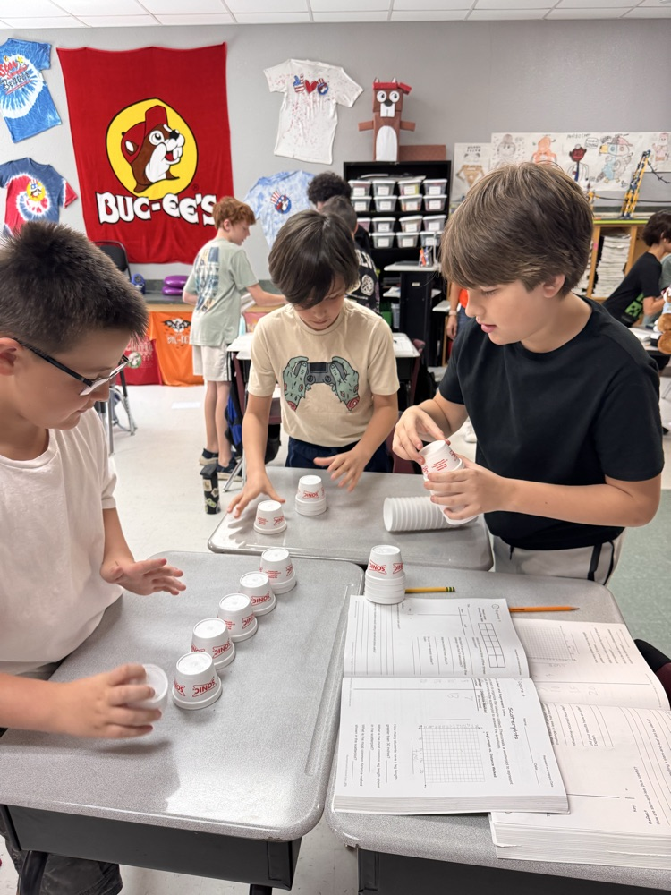 Three boys kept stacking