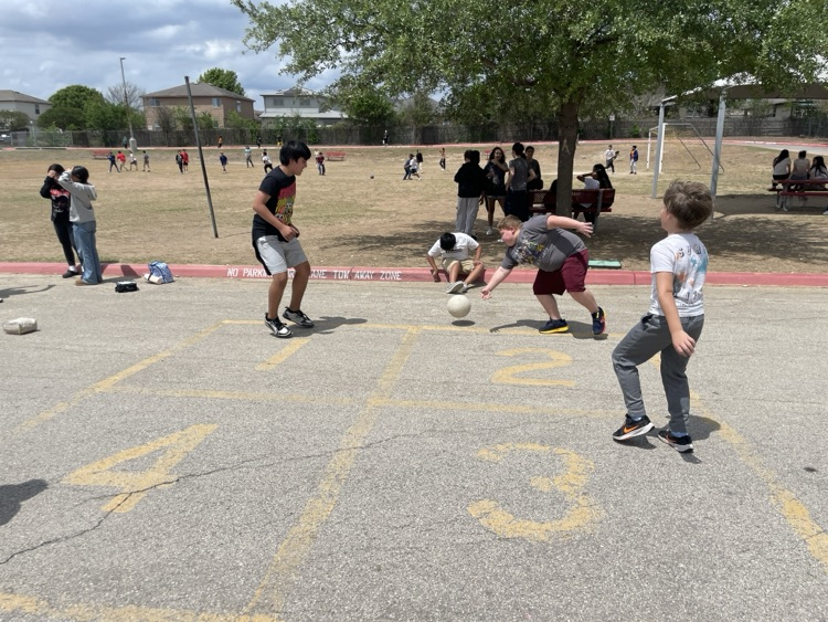 Group of boys playing four square