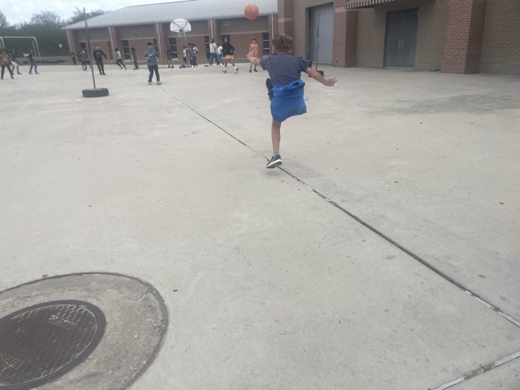 Group of boys playing kickball