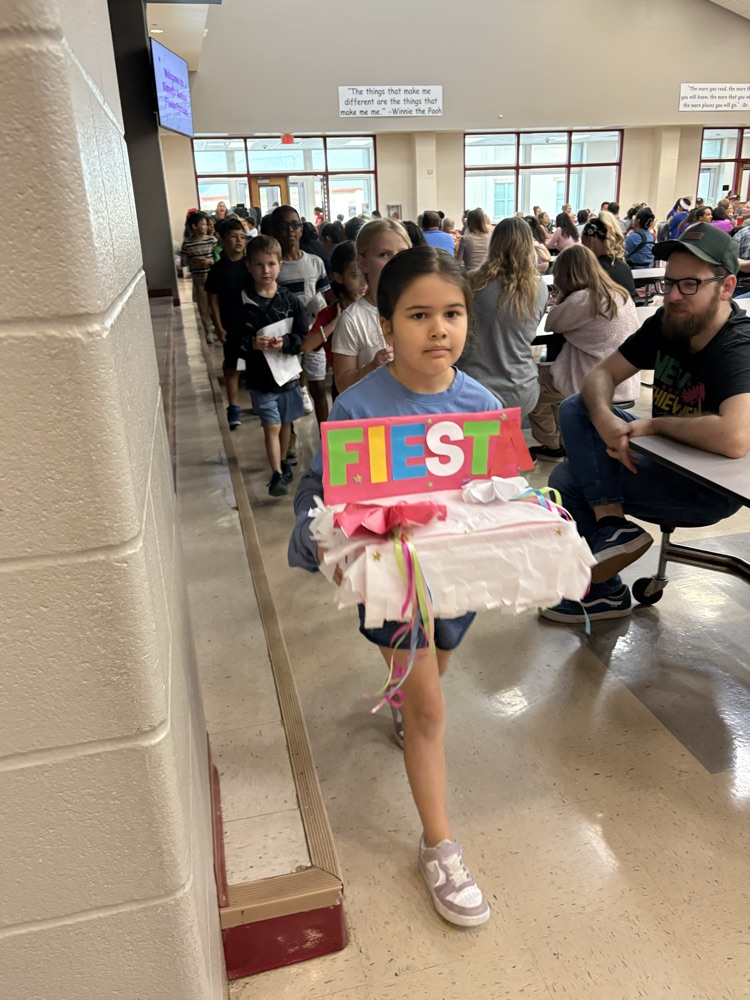 student with fiesta float