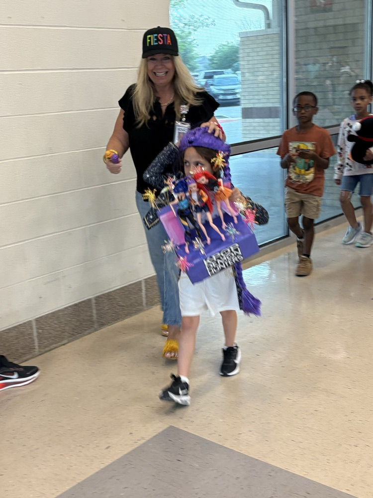 student with fiesta float