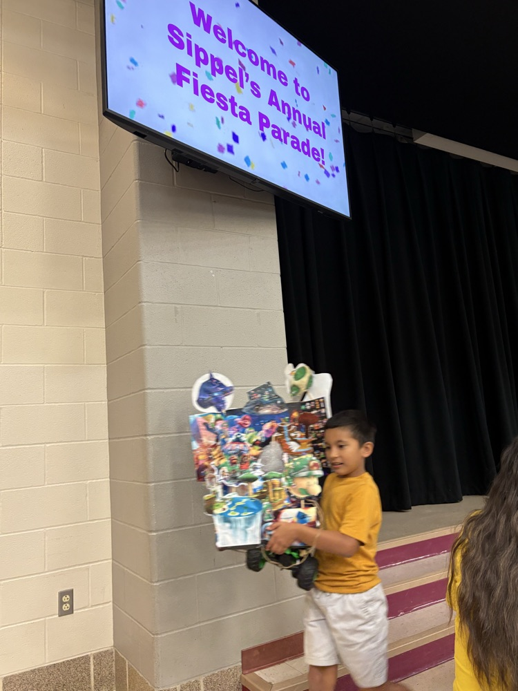 student with fiesta float