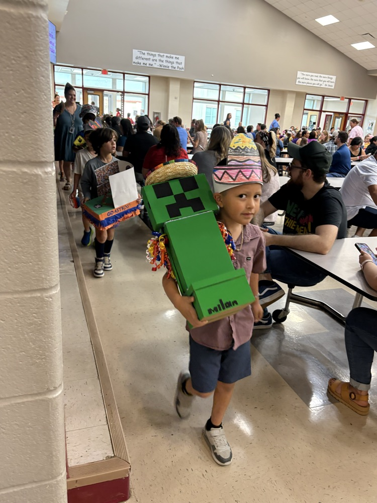 student with fiesta float