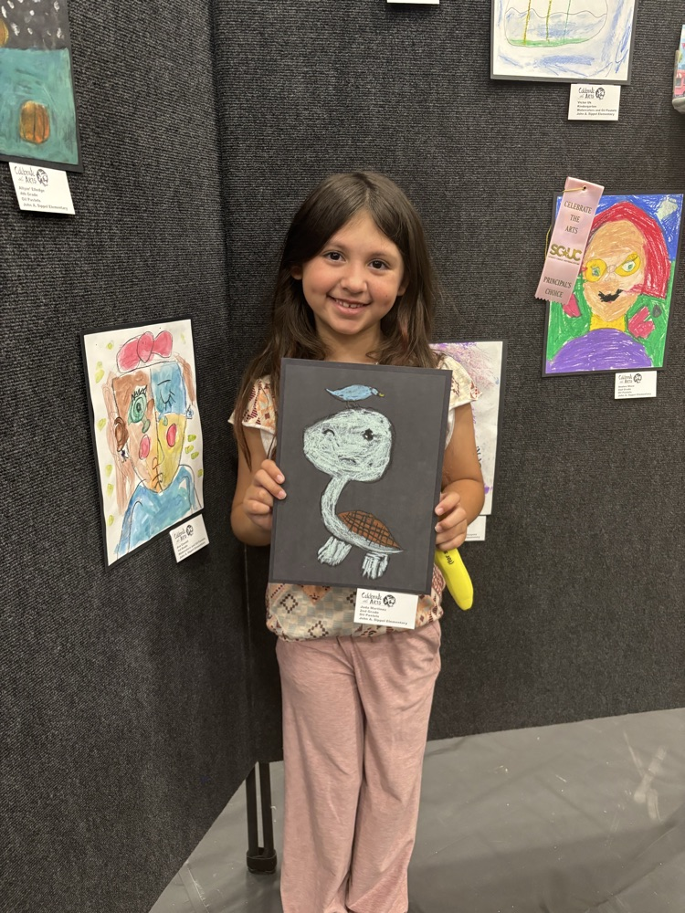 students and their art work at the art show 