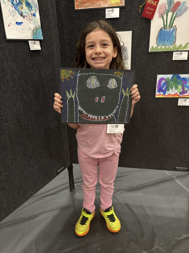 students and their art work at the art show 