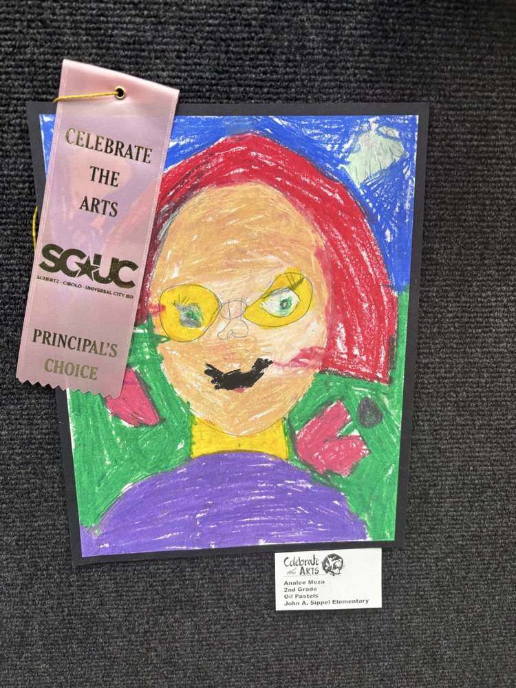 students and their art work at the art show 