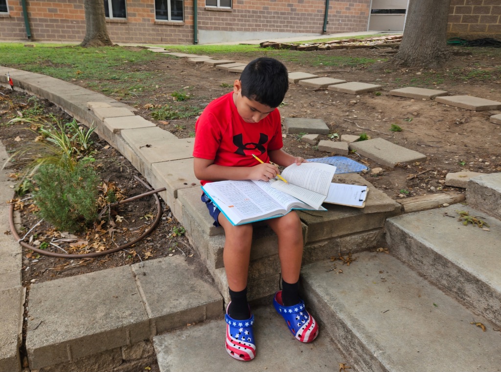 Miss Barrowman's class enjoying a moment to learn outside the classroom
