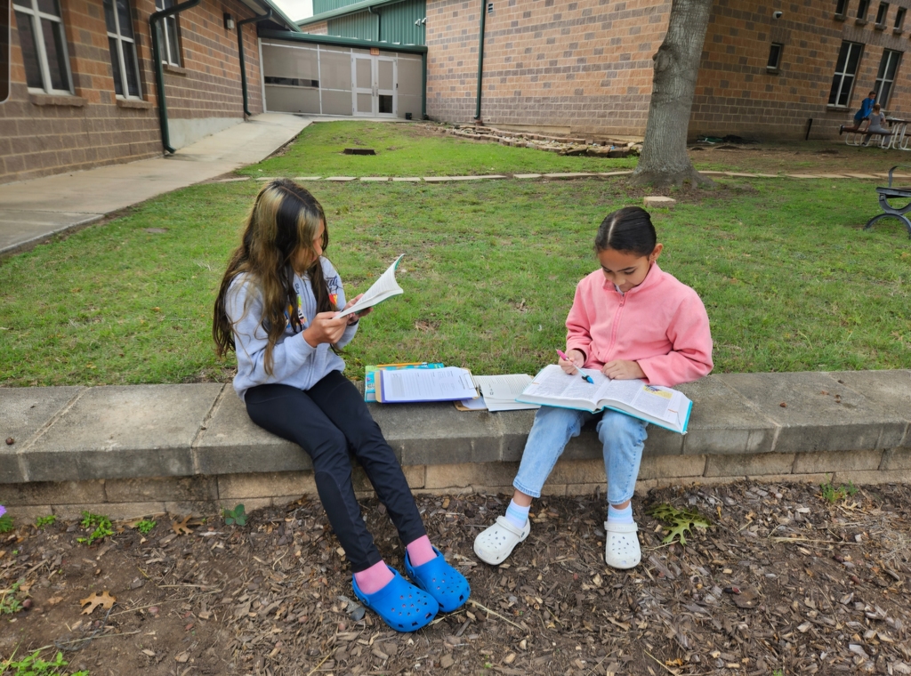 Miss Barrowman's class enjoying a moment to learn outside the classroom