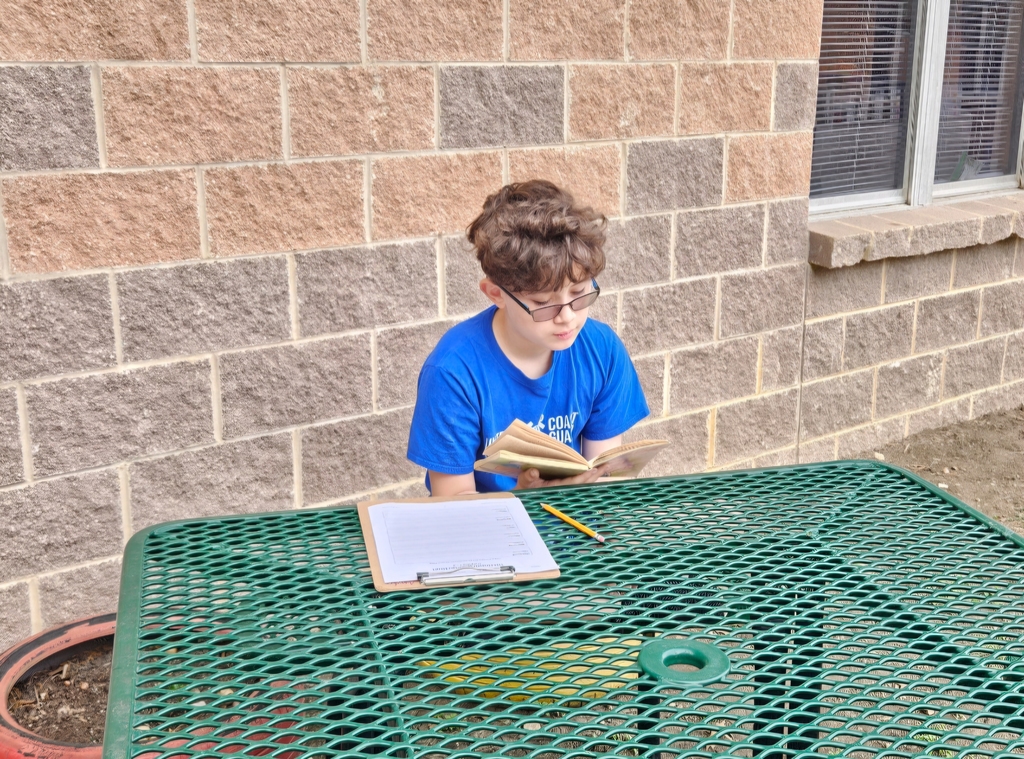 Miss Barrowman's class enjoying a moment to learn outside the classroom