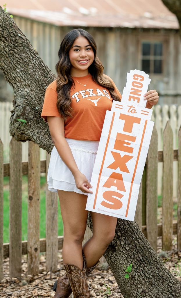 girl holding uT sign