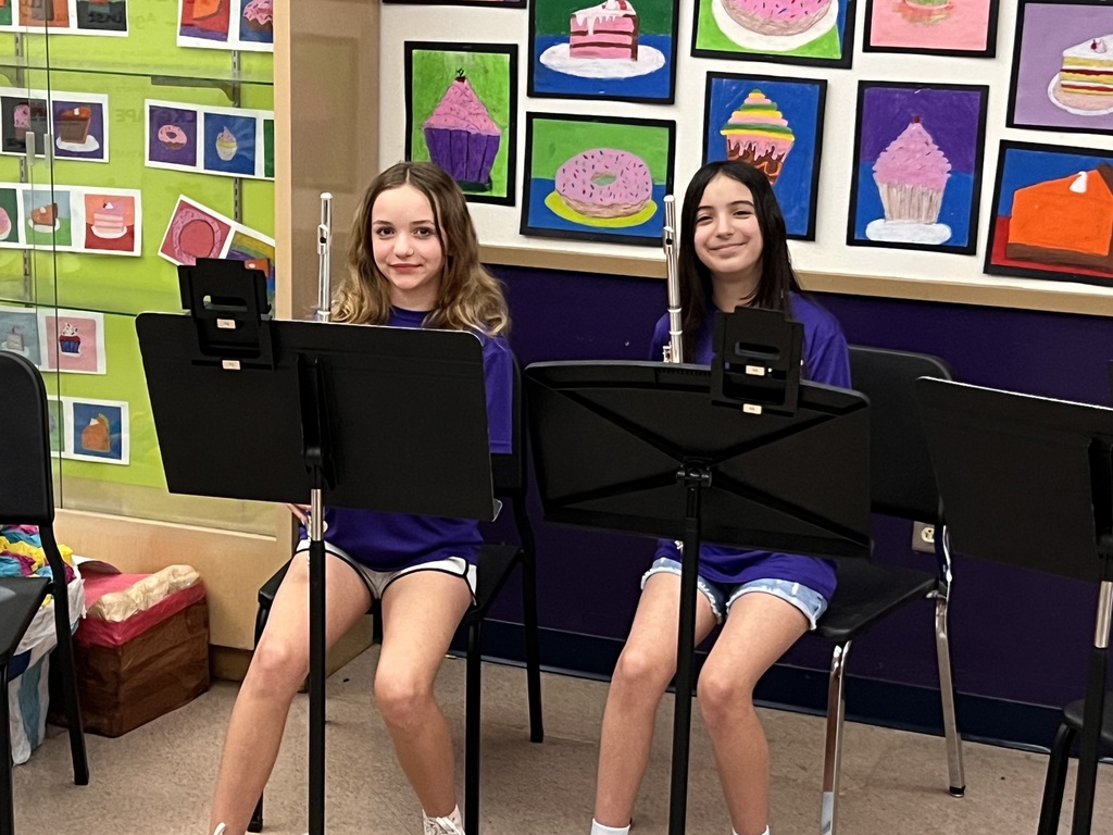 Two girls playing flute
