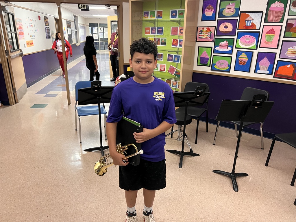 6th grade boy holding trumpet