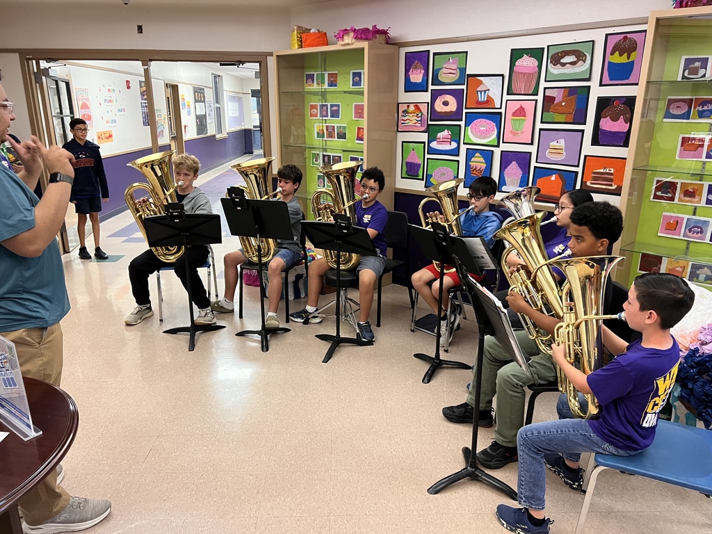 band students playing a song in the foyer
