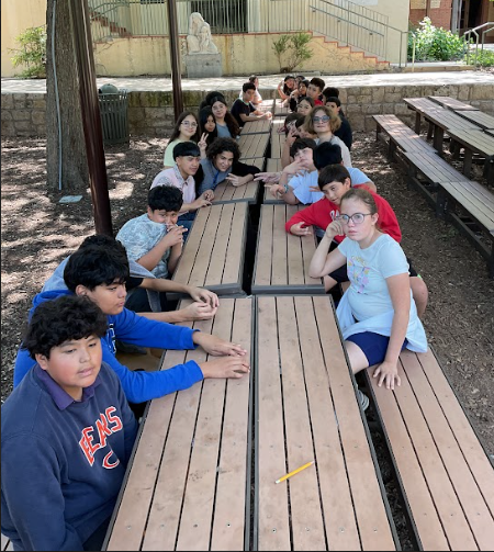 DL students sitting at a picnic table