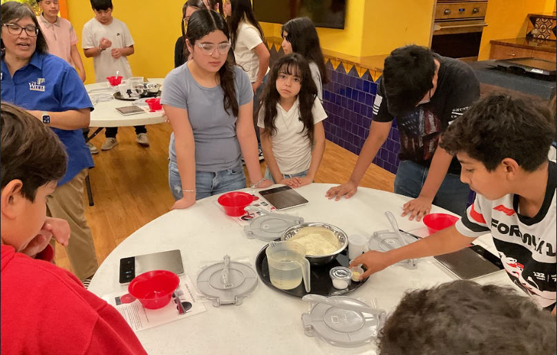 students making tortillas