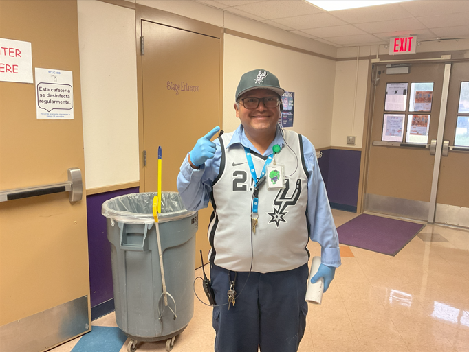 Custodian wearing spurs jersey