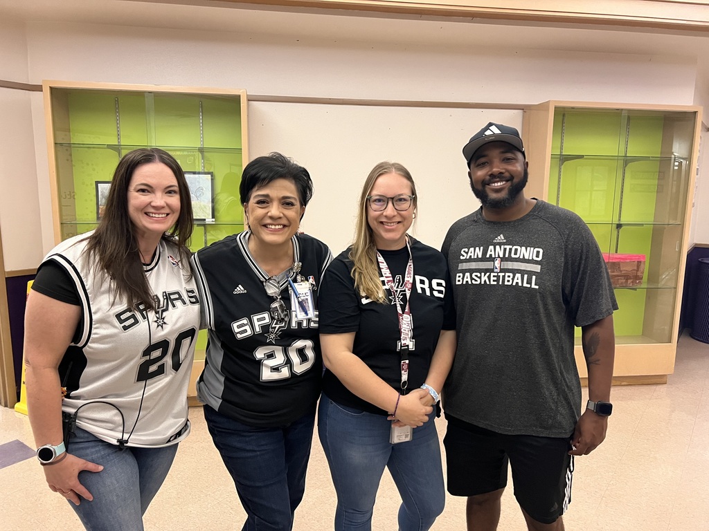 Teachers wearing Spurs shirts