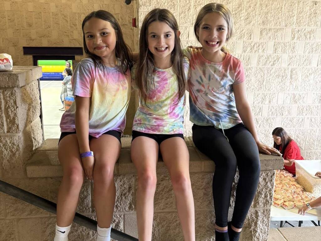 three girls posing for picture