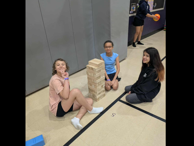 girls playing giant Jenga