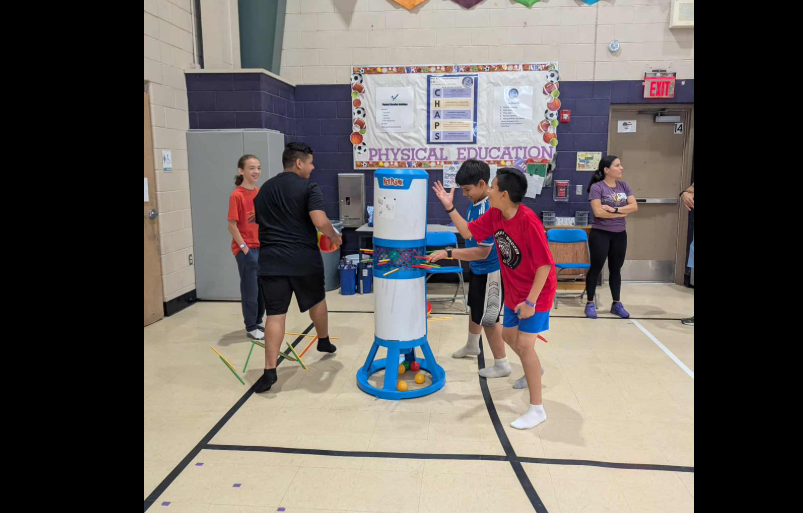 boys playing a sticks and ball game