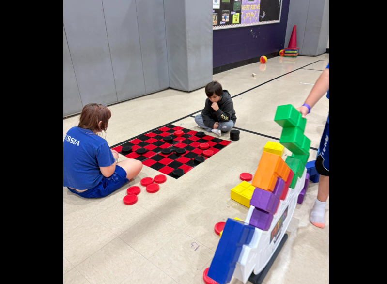 kids playing giant checkers