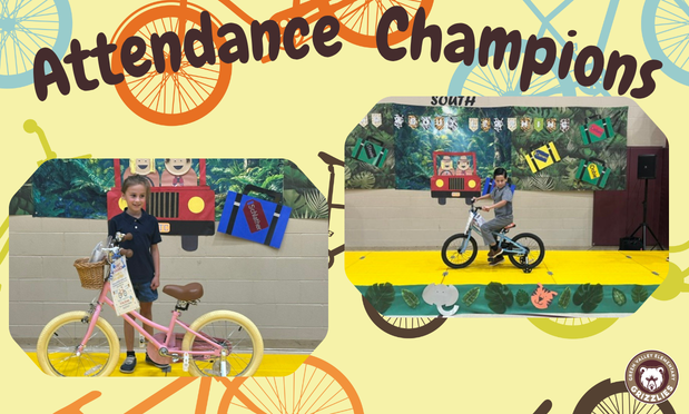 Two first graders receiving bikes for their perfect attendance!