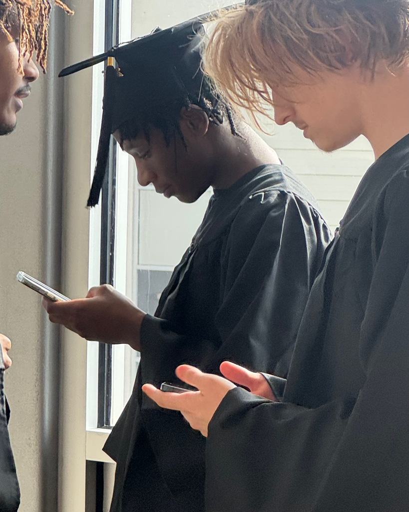 2 students on the phone