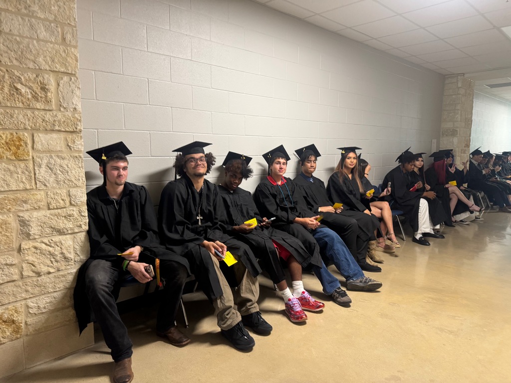 a row of students waiting for their graduation to start
