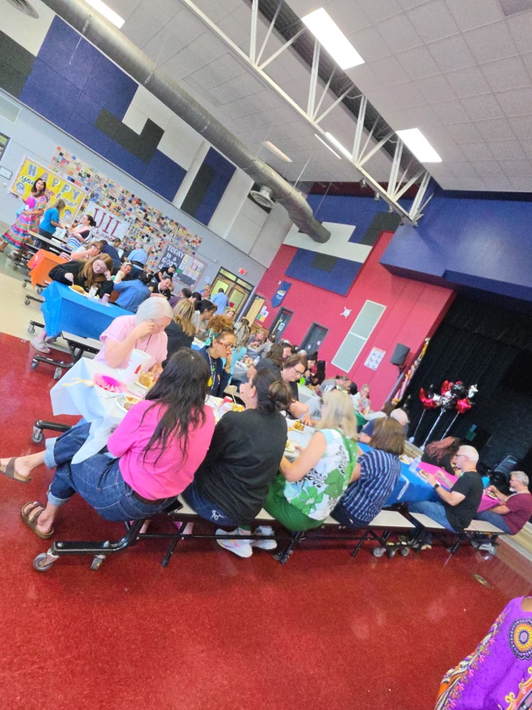 staff eating lunch in the cafeteria