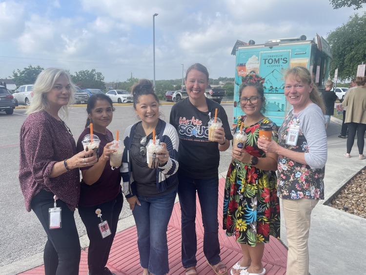 staff holding their frappacinos