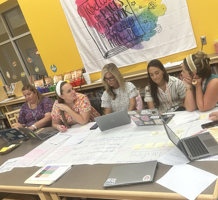Instructional Coach Emily Smitch working side by side with the amazing first grade team as they backwards planned  