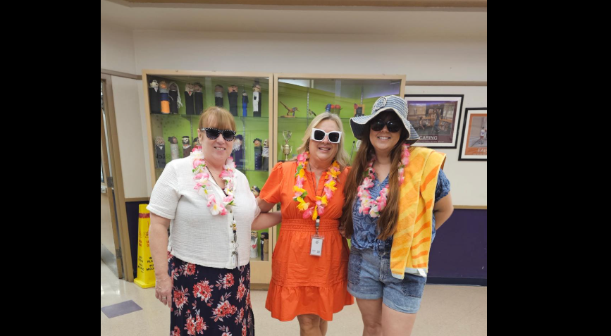 three teachers dressed hawaiian