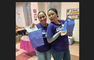 cafe workers with purple prize bags