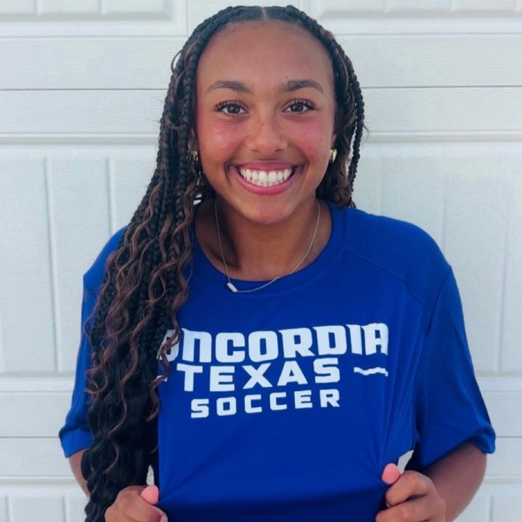 student wearing a Concordia soccer shirt