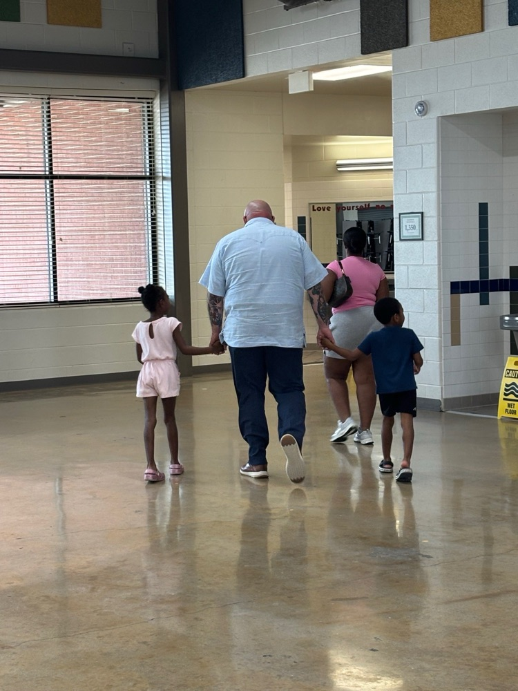 Dr. Dockery escorting students to classrooms.