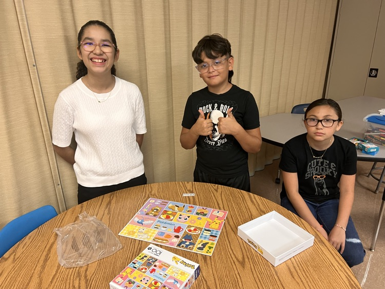 3 students finish a puzzle