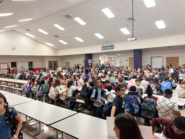 students sitting at cafeteria tables