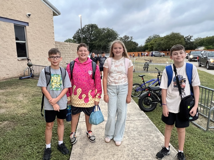 4 students walking to school